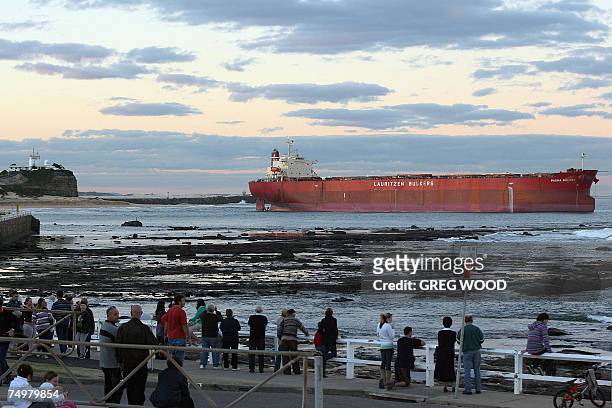 The massive coal carrier Pasha Bulker is seen stranded an Australian beach in Newcastle, New South Wales, 02 July 2007. The coal carrier was close to...