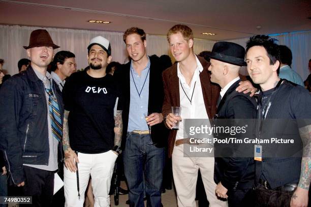 Prince Harry and Prince William meet Jason Pebworth, Kevin Roentgen, Johnny Lonely and Chris Cano of Orson at the after concert party the Princes...