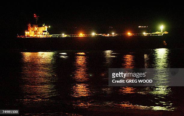 The massive coal carrier Pasha Bulker is towed out to sea from a beach in Newcastle, New South Wales, late 02 July 2007 after an operation overnight...