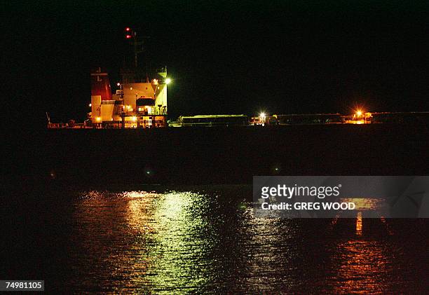 The massive coal carrier Pasha Bulker is towed out to sea from a beach in Newcastle, New South Wales, late 02 July 2007 after an operation overnight...