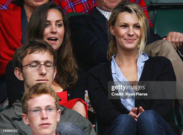 Kate Middleton, girlfriend of Prince William looks on from the crowd during the Men's Singles third round match between Robin Soderling of Sweden and...