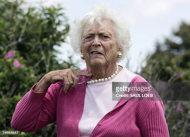 Former First Lady Barbara Bush gestures to the media prior to a press conference by US President George W. Bush and Russian President Vladimir Putin...