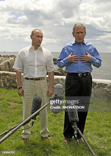 President George W. Bush and Russian President Vladamir Putin hold a joint press conference outside the main house at the Bush family house at...