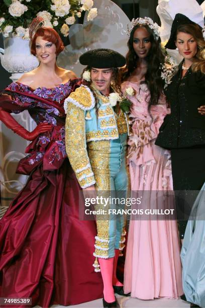 British designer John Galliano acknowledges the public with Canadian model Linda Evangelista and British model Naomi Campbell and Brazilian model...