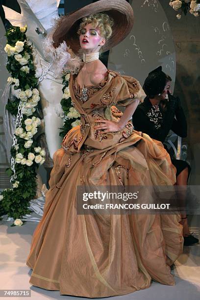 A model displays a creation by fashion designer John Galliano for