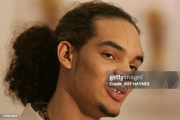 Deerfield, UNITED STATES: Joakim Noah, the first round draft pick of the Chicago Bulls, talks to a local TV reporter 02 July 2007 at the Chicago...