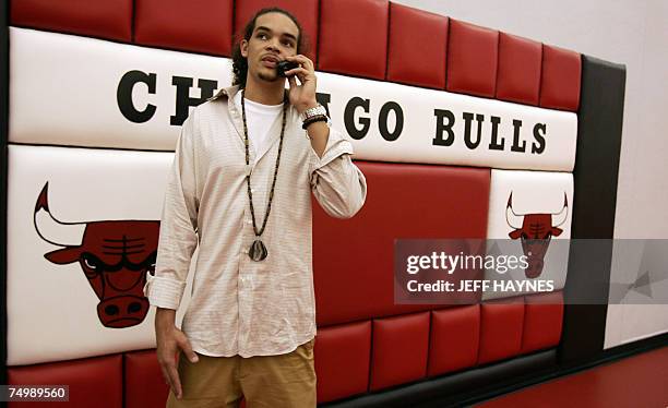 Deerfield, UNITED STATES: Joakim Noah, the first round draft pick of the Chicago Bulls, talks on the phone 02 July 2007 at the Chicago Bulls Berto...