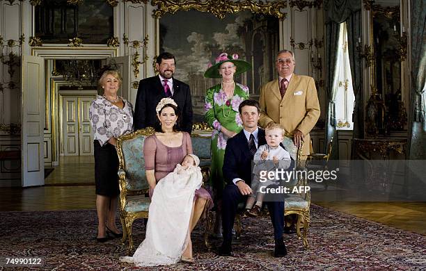 Danish Crown Princess Mary holds her daughter Princess Isabella while her spouse, Crown Prince Frederik holds their son, Prince Christian, as they...