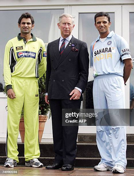 Glasgow, UNITED KINGDOM: Britain's Prince Charles meets Pakistan's cricket captain Shoaib Malik and India's captain Rahul Dravid ahead of their...