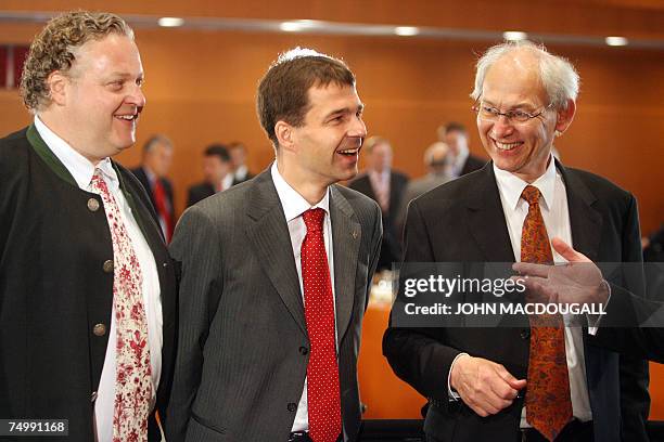 Renewable energy representatives CEO of SolarWorld Franck Asbeck, CEO of Schmack Biogas Ulrich Schmack and the chairman of ENERCON Aloys Wobben chat...