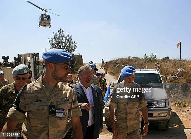 Belgian UN peacekeeping soldiers escort Belgian Defence Minister Andre Flahaut during his visit to their camp in the southern Lebanese village of...