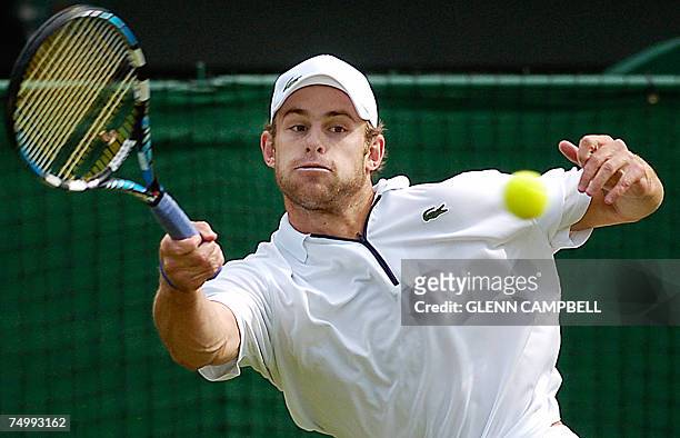 London, UNITED KINGDOM: Andy Roddick of USA returns the ball to Paul-Henri Mathieu of France during the fourth round of the Wimbledon Tennis...
