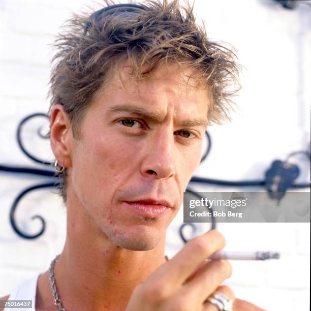 Former Guns and Roses bassist Duff McKagan shows off his martial arts moves during a June 1997 portrait session promoting his new band The Neurotic...