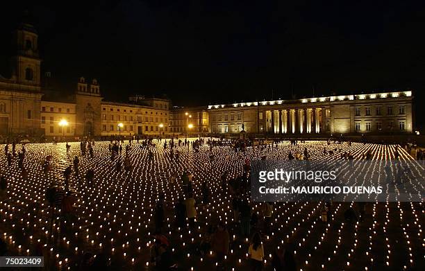 Hundreds of participants light candles during a demonstration against kidnappings 03 July 2007 at Bolivar Square in Bogota. Colombia's main leftist...