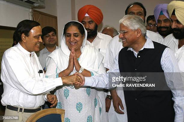 Former Chief Minister and Leader of opposition in the Indian state of Punjab, Rajinder Kaur Bhattal gestures as a member of her delegation shakes...