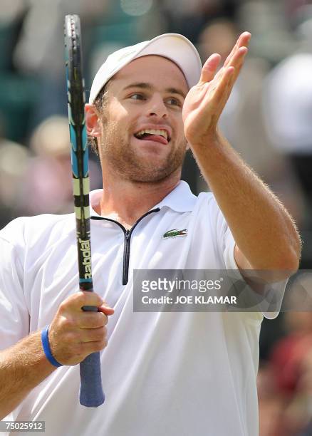 London, UNITED KINGDOM: Andy Roddick of USA acknowledges the audience after defeating Paul-Henri Mathieu of France during the fourth round of the...