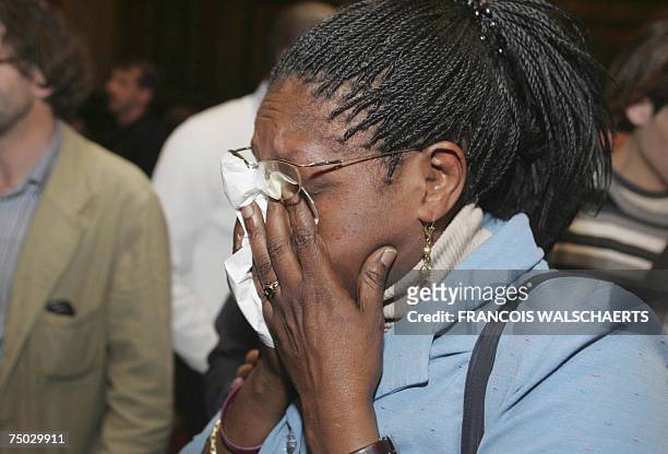 Civilian party's Yolande Mukagasana who had lost her husband, her three children and her sister in Rwanda shows lots of emotion after the jury...