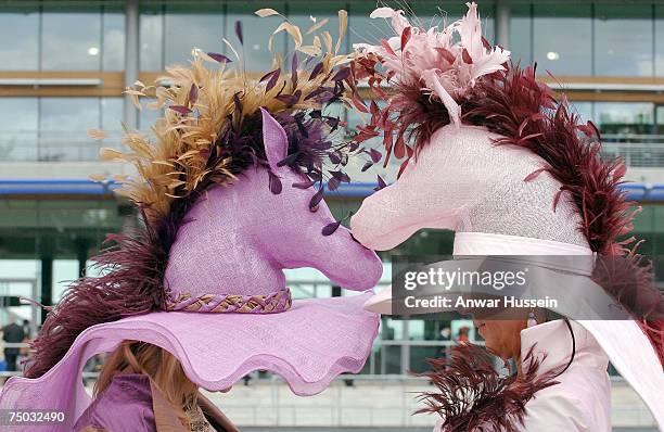 Racegoers wear matching horse themed hats for Ladies Day at Royal Ascot on June 21, 2007