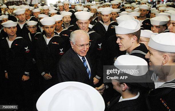 Australian Prime Minister John Howard meets with the crew aboard the USS Kitty Hawk during his tour of the ship, 05 July 2007. The 323-metre...