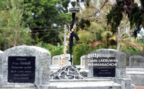 In this photograph taken 01 July 2006, Tamil Tiger graves are pictured at a "martyrs'" cemetery outside the rebel-held town of Kilinochchi in...