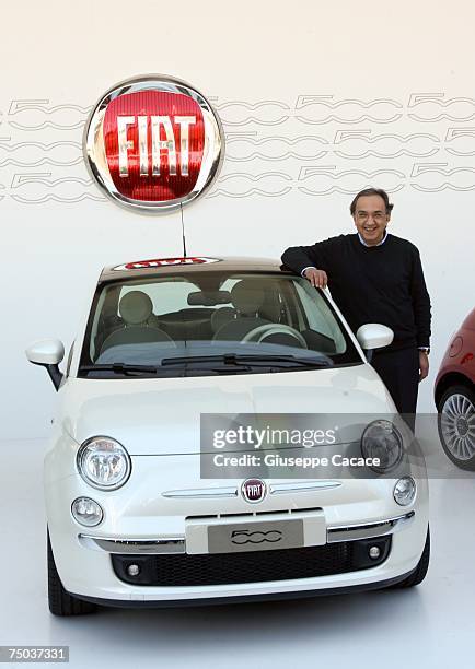 Sergio Marchionne Ceo of Fiat Group pose next to the new Fiat 500 car at the end of a press conference at Palaisozaki on 05 July 2007 in Turin,...