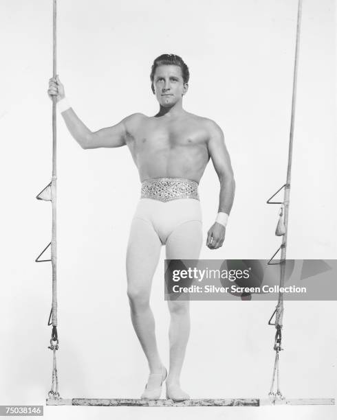 American actor Kirk Douglas stars as trapeze artist Pierre Narval in the MGM film 'The Story of Three Loves', 1953.