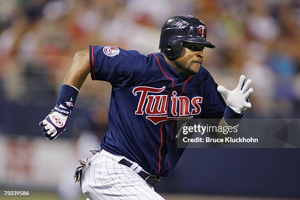 Luis Castillo of the Minnesota Twins runs to first base against the Toronto Blue Jays at the Humphrey Metrodome in Minneapolis, Minnesota on June 27,...