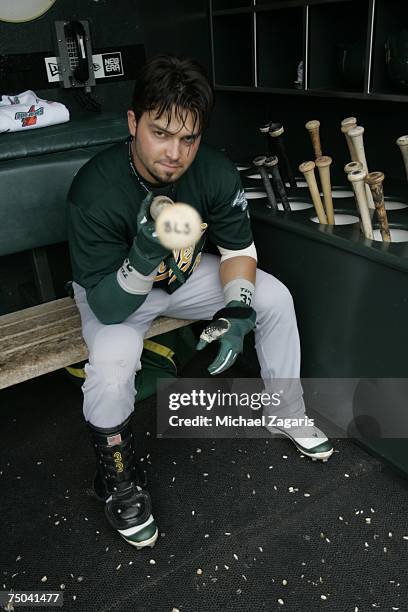 Nick Swisher of the Oakland Athletics prepares in the dugout before the game against the San Francisco Giants at AT&T Park in San Francisco,...