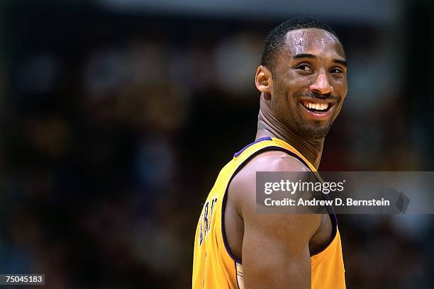Kobe Bryant of the Los Angeles Lakers cracks a smile during a 2002 NBA game at the Staples Center in Los Angeles, California. NOTE TO USER: User...