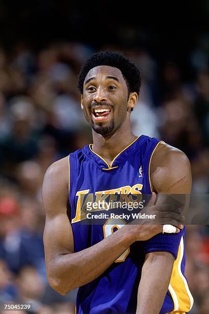 Kobe Bryant of the Los Angeles Lakers cracks a smile during a 2001 NBA game. NOTE TO USER: User expressly acknowledges that, by downloading and or...