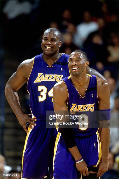 Kobe Bryant and Shaquille O'Neal of the Los Angeles Lakers have a laugh during a 2001 NBA game. NOTE TO USER: User expressly acknowledges that, by...