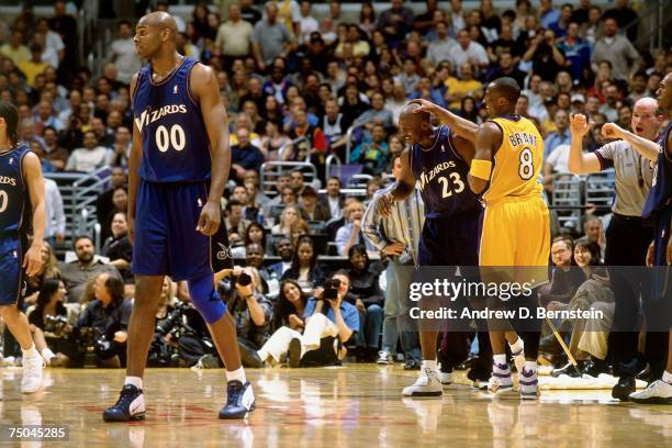 Kobe Bryant of the Los Angeles Lakers has a laugh with Michael Jordan of the Washington Wizards during a 2003 NBA game at the Staples Center in Los...