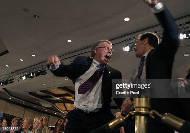 Members of the Russian delegation cheer after hearing the annoucement that the city of Sochi had won the right to host the 2014 Winter Olympic Games,...