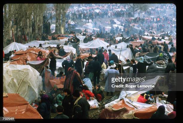 Crowd of refugees stands near tents April 1, 1999 in Macedonia. Thousands of Kosovar Albanians fled the violence in Serbia and arrived at Blace, a...