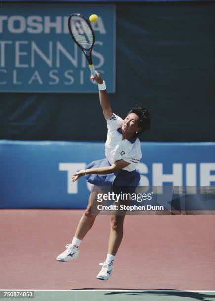 Ai Sugiyama of Japan serves during a WTA Women's Doubles match at the Toshiba Classic Tennis Tournament on 5 August 1994 at the La Costa in San...