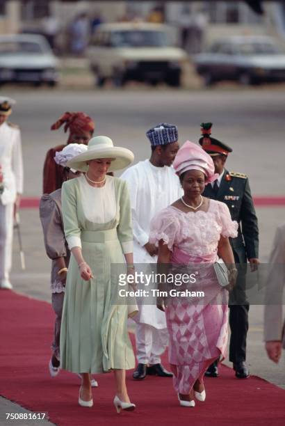 Diana Princess of Wales arrives in Lagos, Nigeria, for an official visit, 15th March 1990. With her is Nigerian First Lady, Maryam Babangida. The...