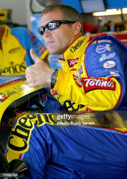 Bobby Labonte, driver of the Cheerios/Pillsbury Cinnabon Dodge, stands in the garage before practice for the NASCAR Nextel Cup Series Pepsi 400 at...