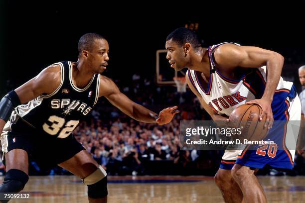 Allan Houston of the New York Knicks makes a move against Sean Elliot of the San Antonio Spurs in Game Five of the 1999 NBA Finals at Madison Square...