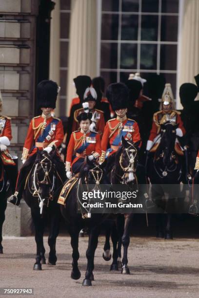 Queen Elizabeth II riding sidesaddle during the Trooping the Colour procession, London, 13th June 1981. Behind her are Prince Charles and Prince...