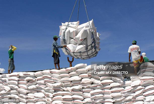 The National Food Athority of the Philippines imports rice from Vietnam on board the cargo ship Vinh Phuoc as workers unload 10,800 tons of rice,...