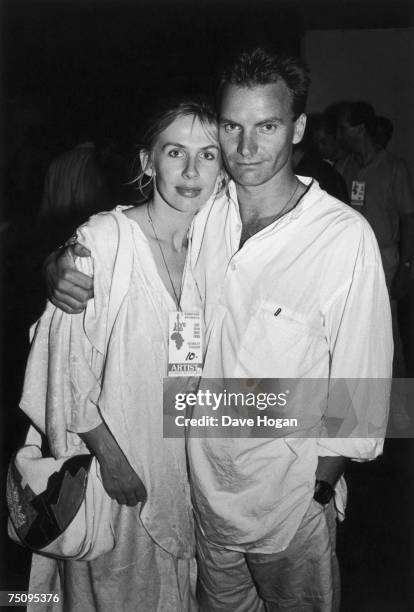 English singer-songwriter Sting with his wife Trudie Styler backstage at the Live Aid concert at Wembley Stadium, London, 13th July 1983.