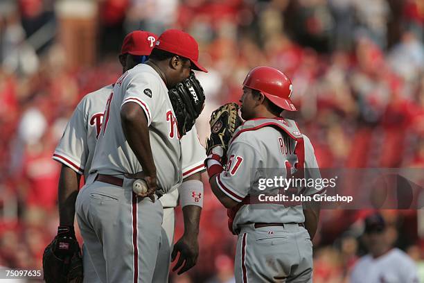 Antonio Alfonseca of the Philadelphia Phillies talks with Carlos Ruiz during the game against the St. Louis Cardinals at Busch Stadium in St. Louis,...