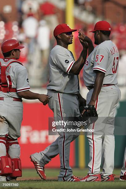 Ryan Howard of the Philadelphia Phillies high fives Antonio Alfonseca after the victory against the St. Louis Cardinals at Busch Stadium in St....