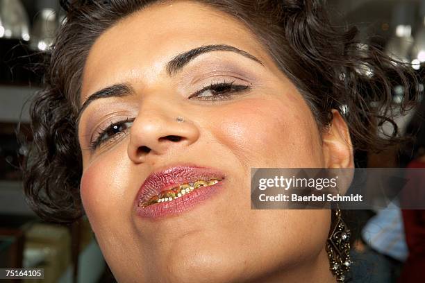 woman with gold teeth, close-up - tooth cap stock pictures, royalty-free photos & images