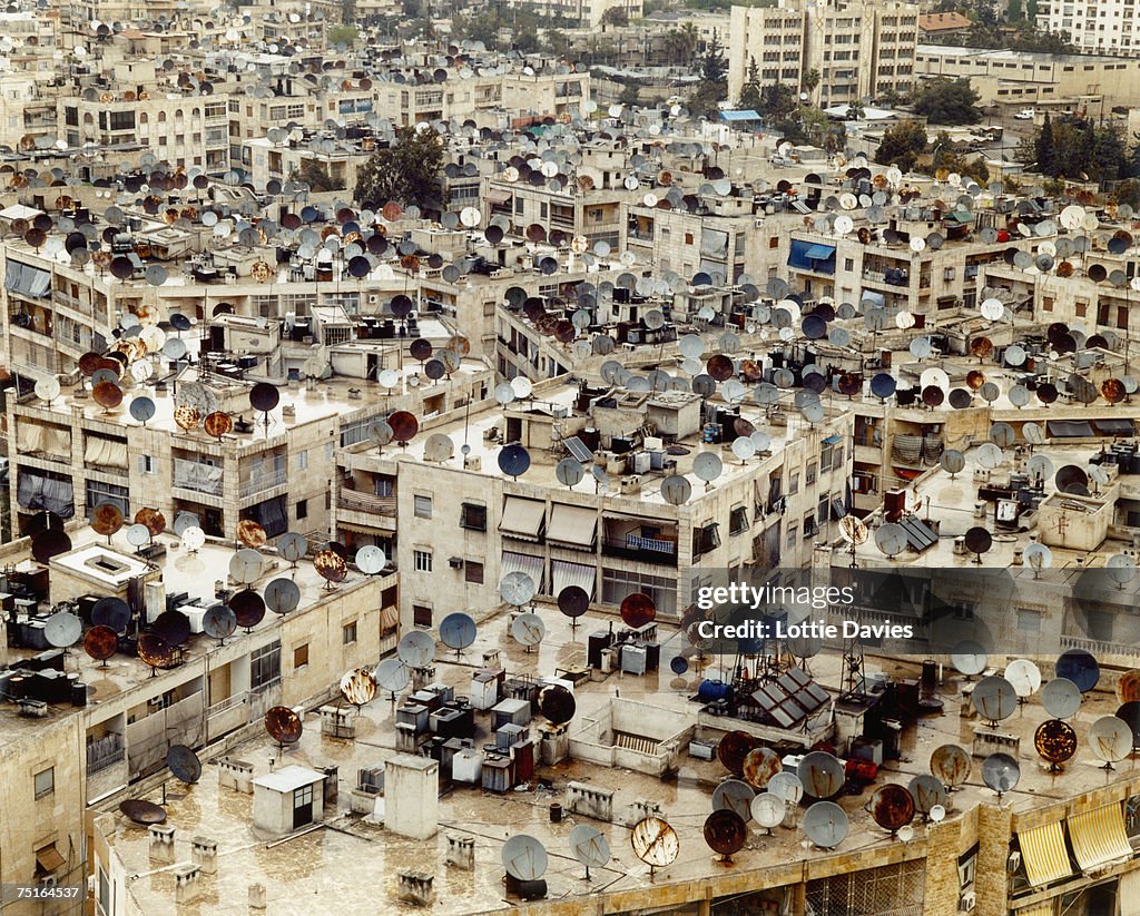 Syria, Aleppo, rooftops of apartment buildings covered with satellite dishes, elevated view