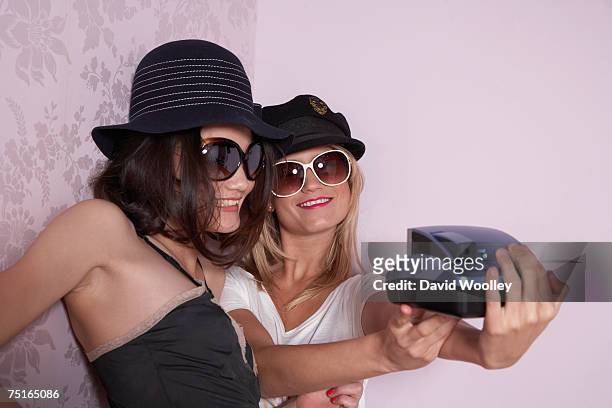 young woman and teenage girl (16-17) dressed up, photographing themselves - girls playing with themselves bildbanksfoton och bilder
