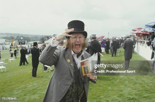 English horse racing journalist and pundit, John McCririck pictured in top hat and formal dress as he attends the 1993 Epsom Derby horse race meeting...