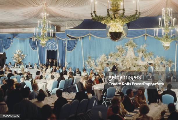 View of a host of world leaders, heads of state, royalty and dignitaries invited by Shah of Iran Mohammad Reza Pahlavi and assembled in a large tent...