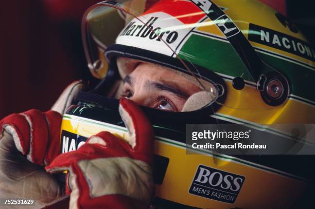 Ayrton Senna of Brazil sits aboard the Honda Marlboro McLaren McLaren MP4/5 Honda V10 before the Fuji Television Japanese Grand Prix on 22 October...