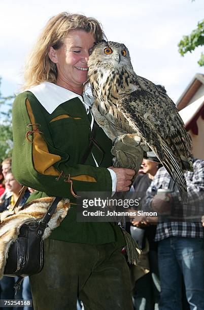Falconer carrying an owl participates at the opening parade of the traditional Kaltenberg Knight Tournament on July 6, 2007 in Kaltenberg, Germany....